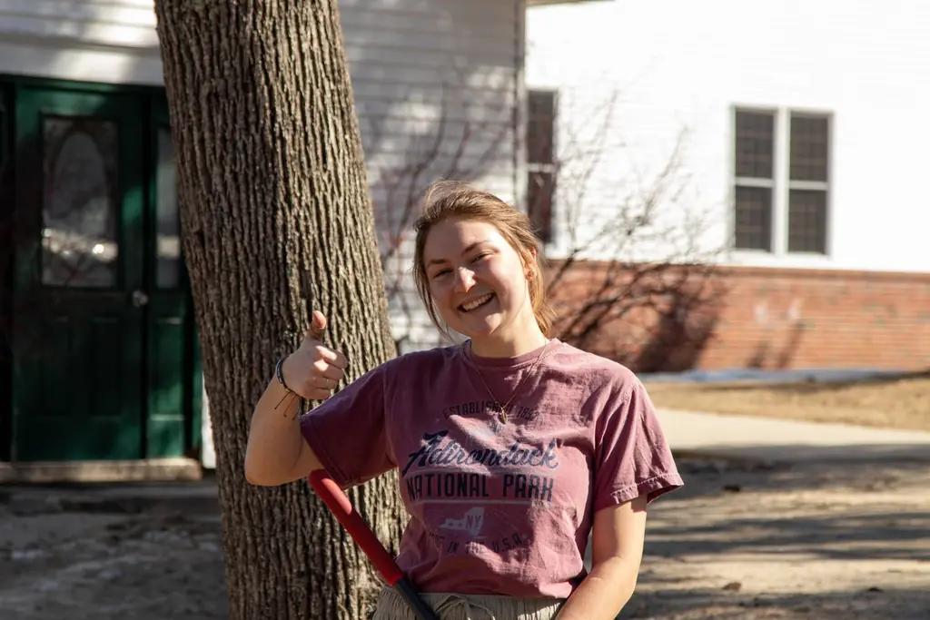 Krystel doing some spring clean up around the property