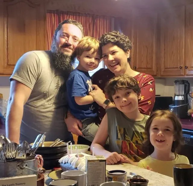 Sue and Jeremy celebrating with their children (2020)