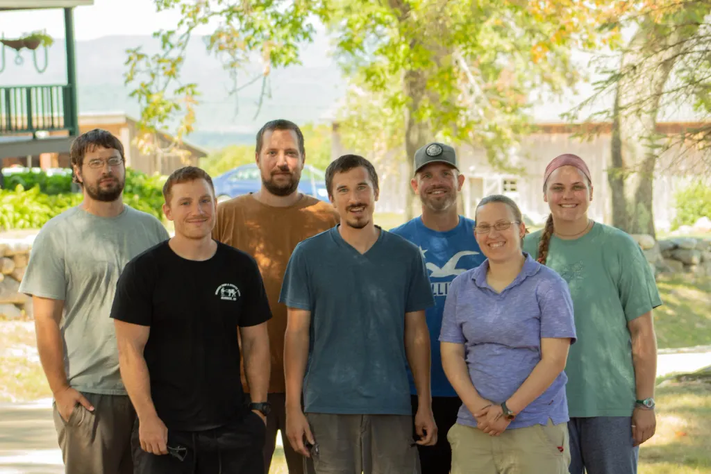 Dave and his fellow graduates, smiling for a group picture a few weeks before graduation (2020).
