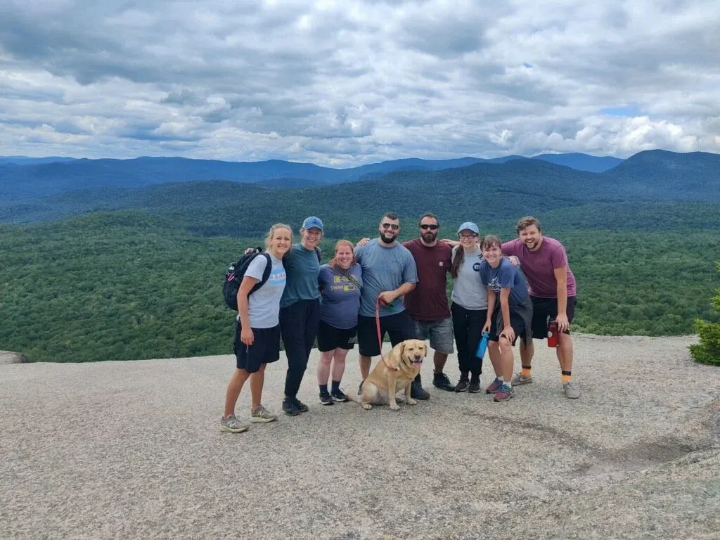 Erin hiking with other staff members last summer