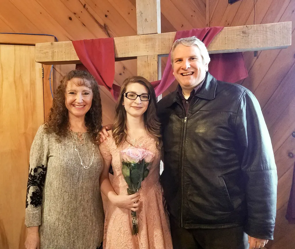 Vanessa and her parents celebrating her graduation from the Resident Program.