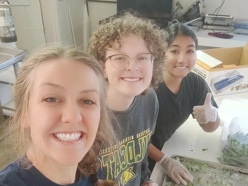 Amanda preserving this year’s harvest in the canning room, with her fellow Servant Leaders