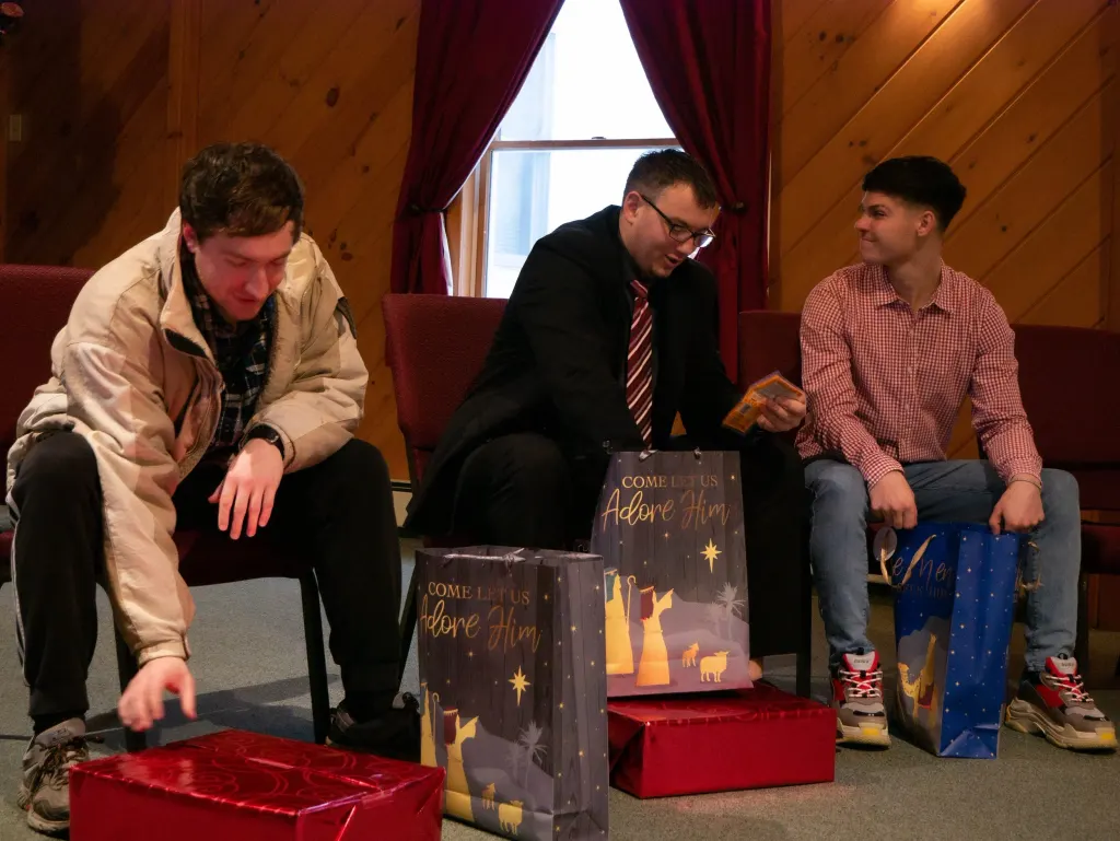 Some of the men in our Resident program opening their Christmas gifts last year