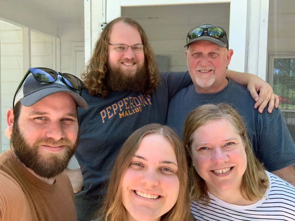 Claire (middle) with her family.